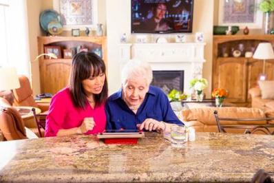 Woman and Elder on Ipad Woman and Elder on Ipad